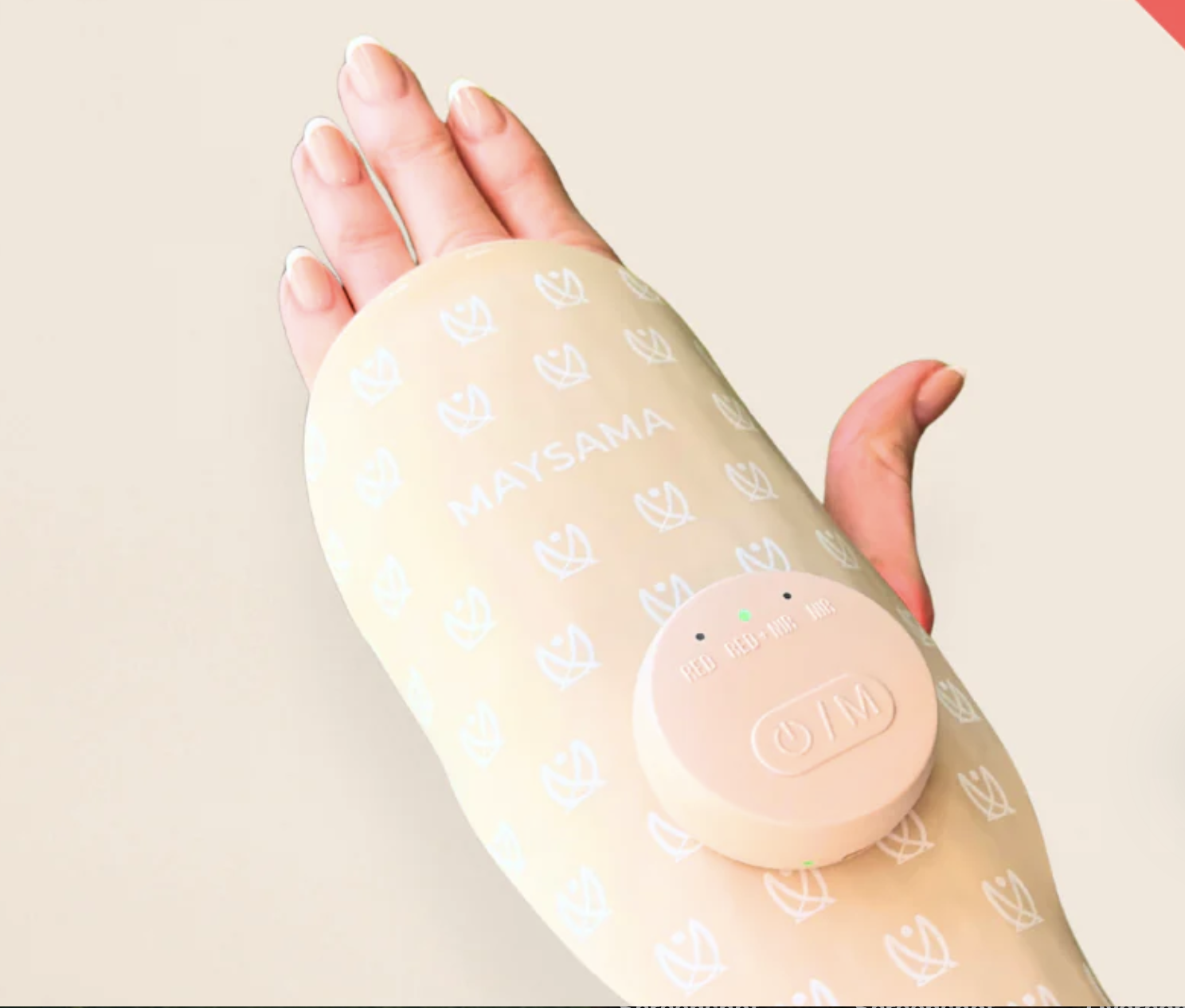 Maysama's hand therapy glove pictured worn on a hand against a cream background