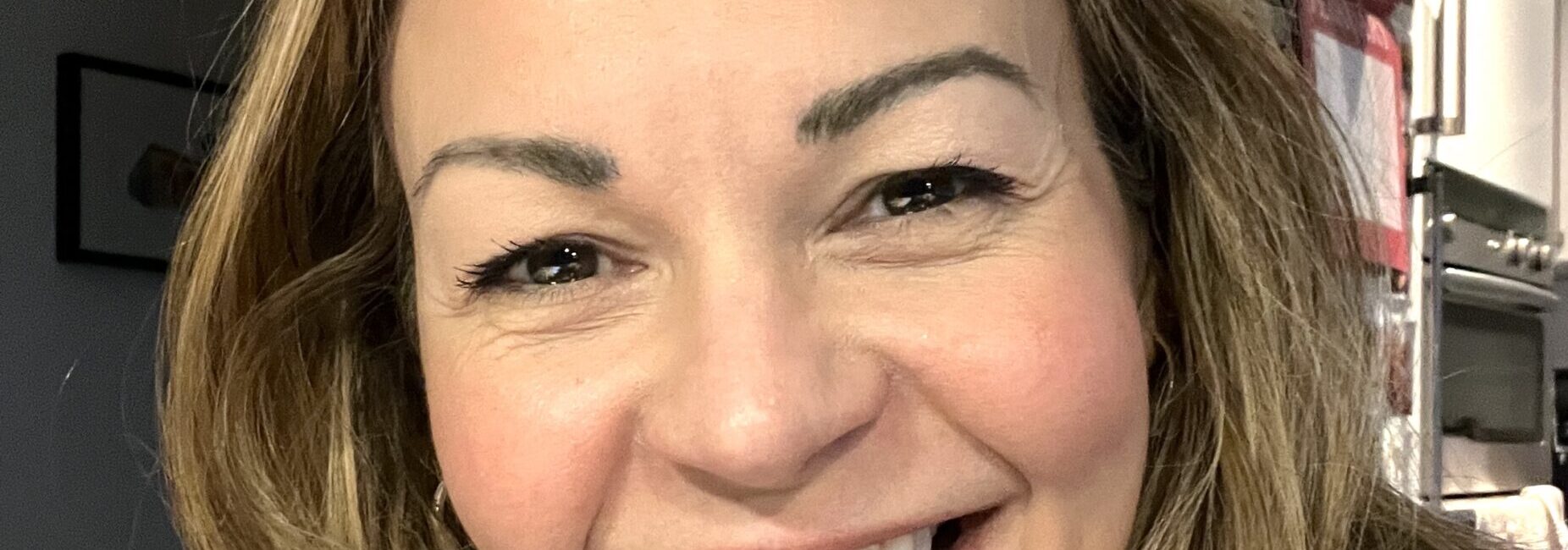 A smiling photo of journalist Clare Johnston