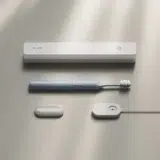 A picture of the Suri electric toothbrush with accessories