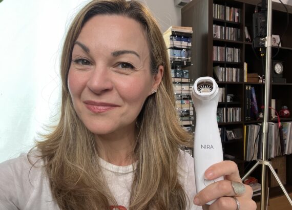 Clare Johnston holds a Nira laser device