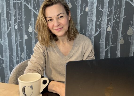 Journalist Clare Johnston pictured by her laptop