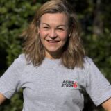 A picture of Clare Johnston wearing an Aging Strong T-shirt from the new Age Strong Collection