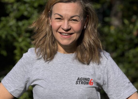 A picture of Clare Johnston wearing an Aging Strong T-shirt from the new Age Strong Collection
